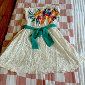 Lace strapless mini dress with colorful embroidery and teal wrap around belt